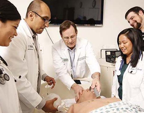 Find a Job and a Career | UNT System Human Resources Faculty member shows medical